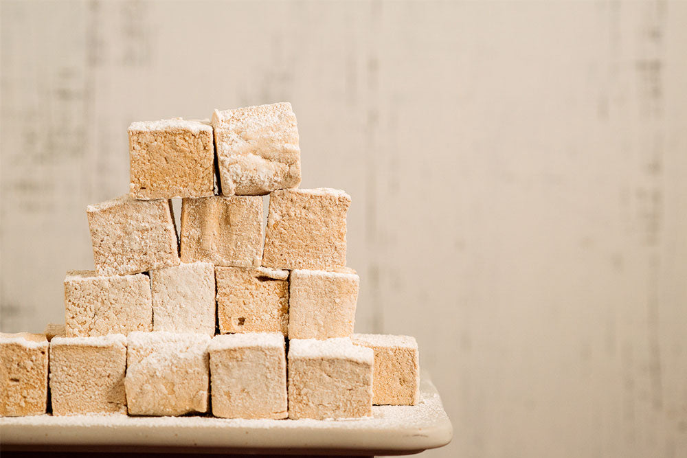 Photo of a stack of fluffy flavored marshmallows.