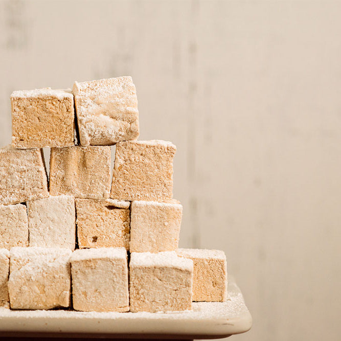 Photo of a stack of fluffy flavored marshmallows.