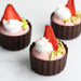 Strawberry Mousse-filled Cup with Strawberry Slice, Whipped Cream, and Pistachios