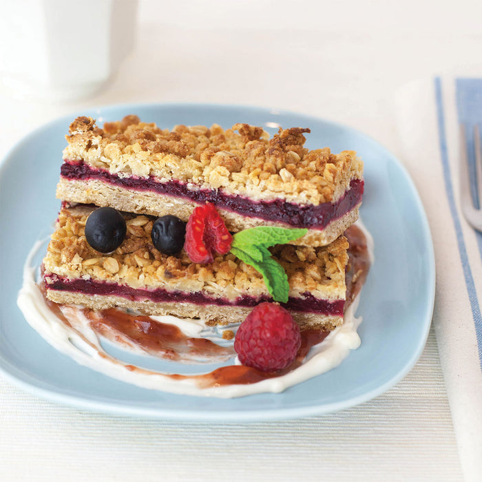 triple berry crumble bar, stacked with fresh fruit and mint