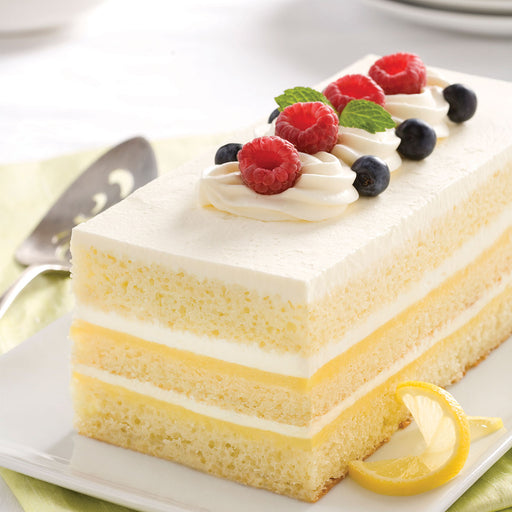 slice of layered lemons and cream shortcake with fruit