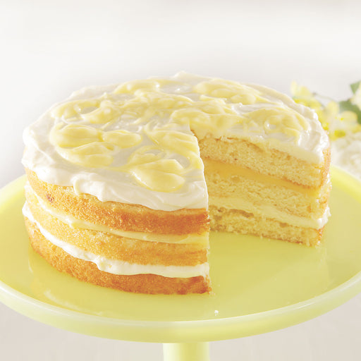 lemonade cake, layered, full cake missing one slice