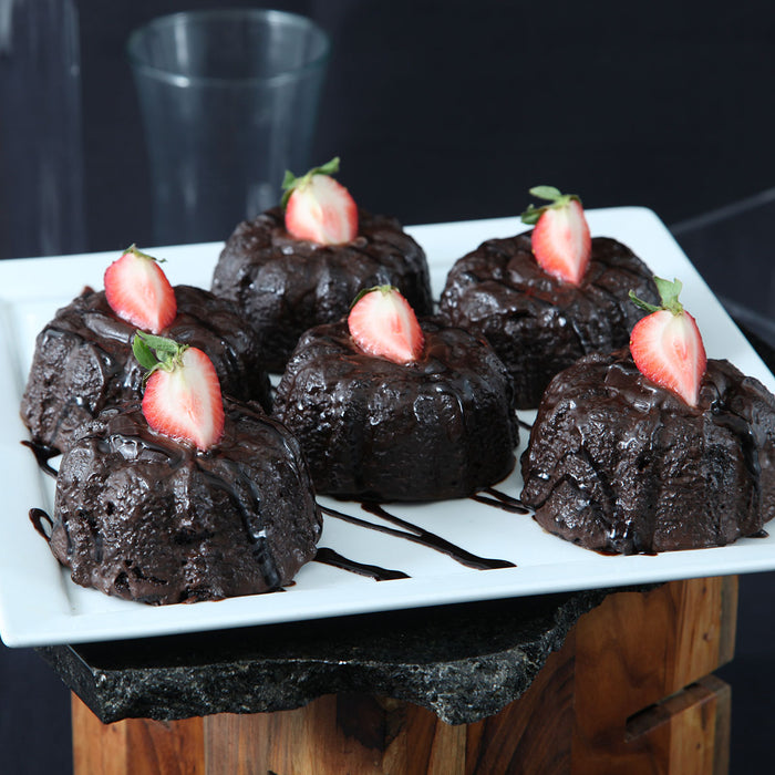 molten chocolate cakes on plate with strawberries